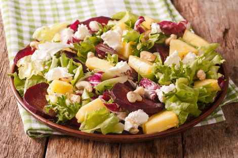 Sweet and tangy beet and pineapple salad, topped with crumbled feta cheese